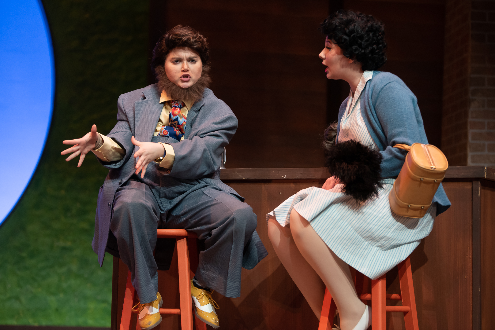 The Merry Wives of Windsor - Scenic design by Brandon PT Davis. Elizabethan village square, timber-framed houses, bustling market, vibrant colors.