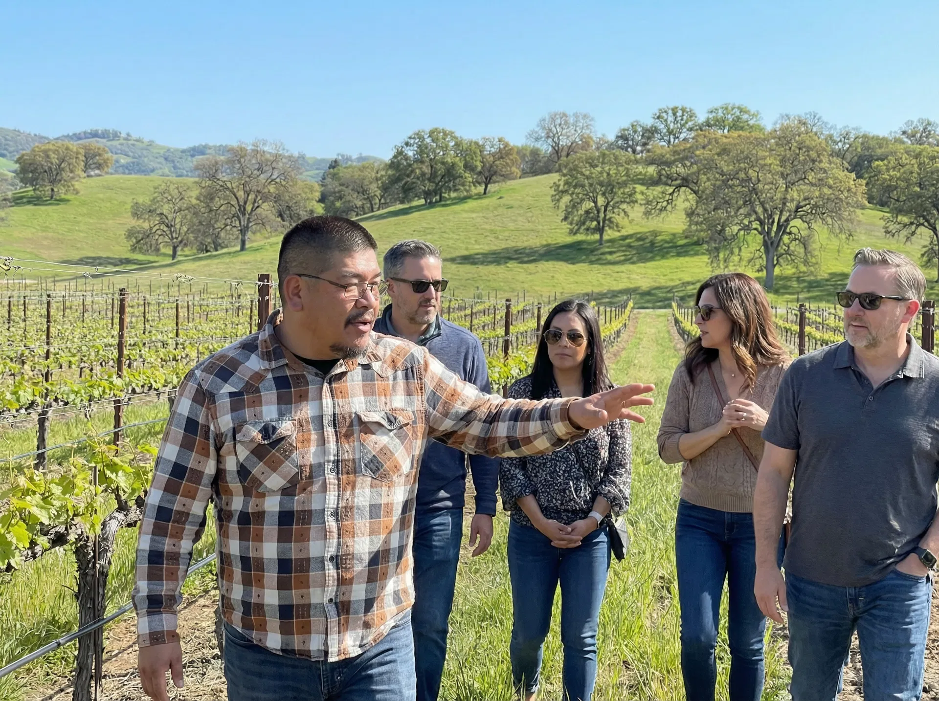 Carlos with guests in vineyard