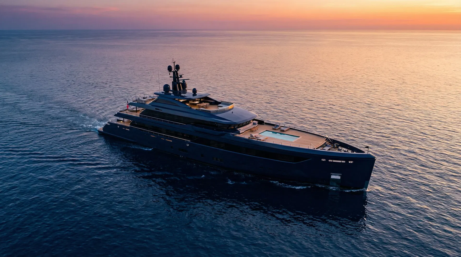 Luxury yacht on calm ocean at golden hour