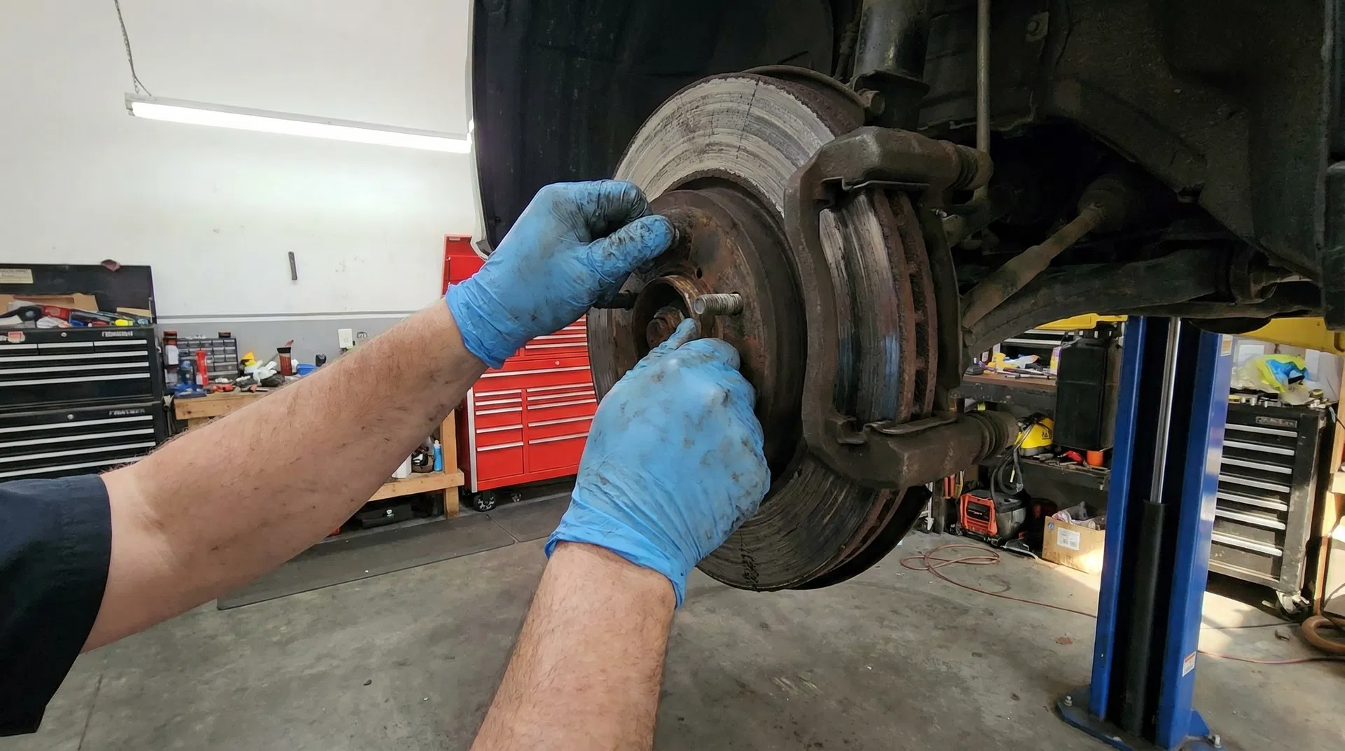 CTR technician removing worn brake rotor