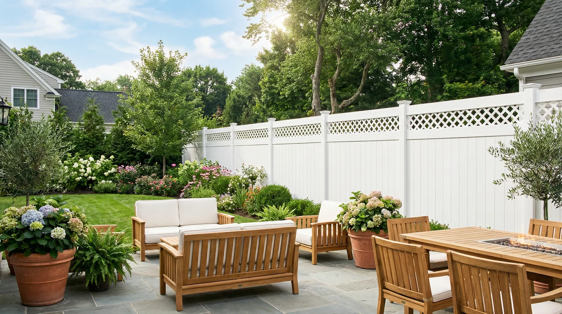 Premium white vinyl privacy fence with lattice top installed in a beautiful Syracuse NY backyard