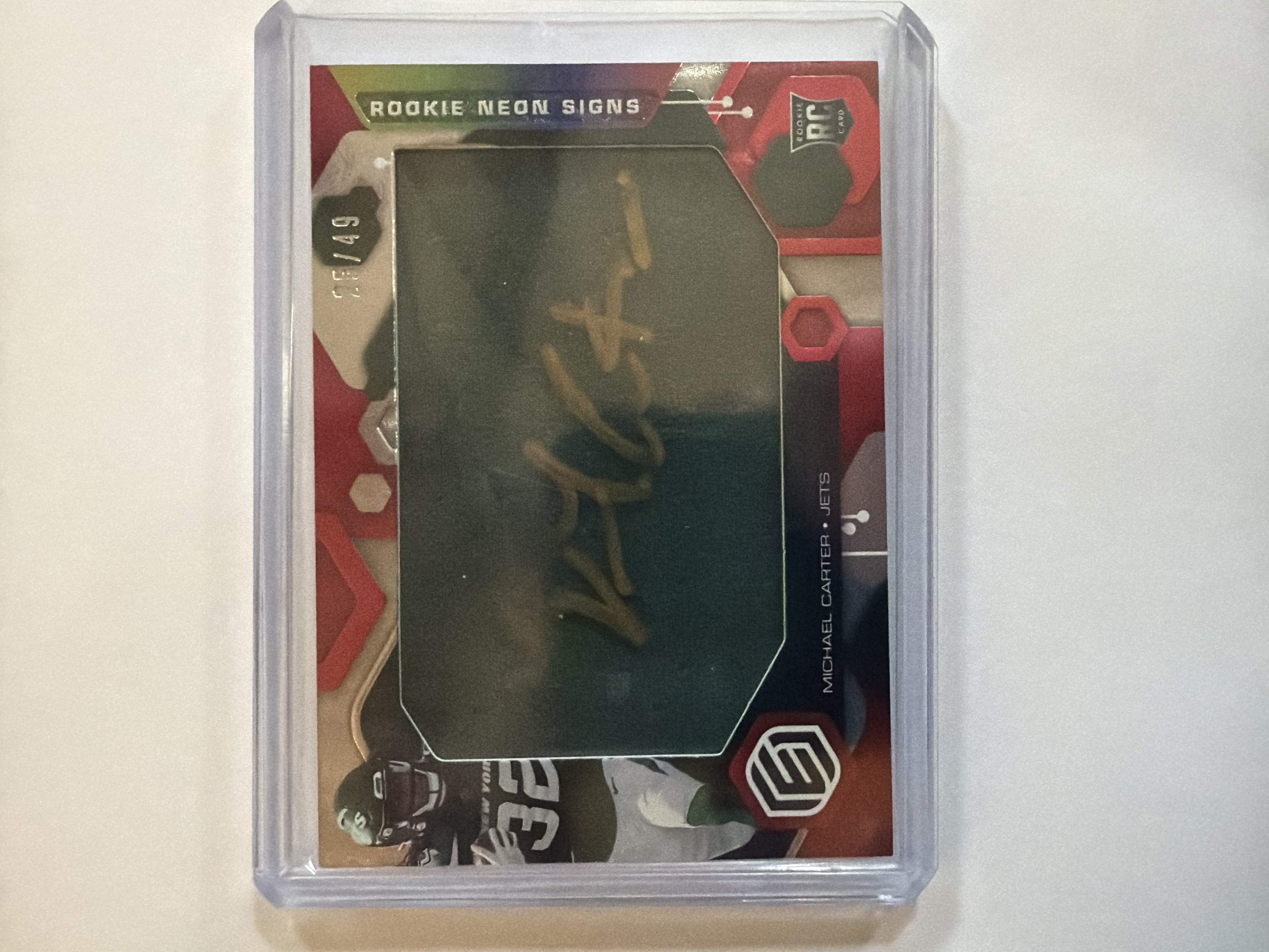 Michael Carter II 2021 Panini Elements Rookie Neon Signs Autograph Patch /49 Rookie Neon Signs Autograph Patch - Trading Card Image