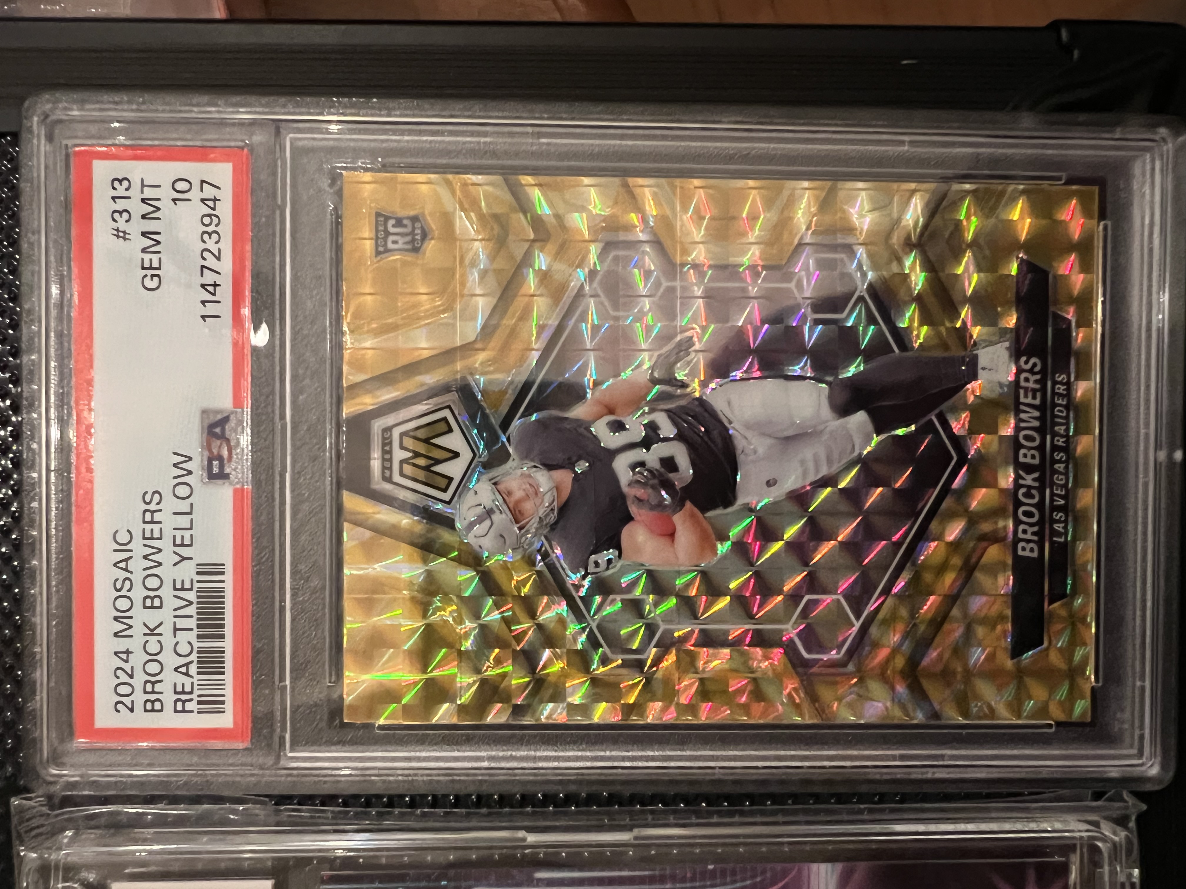 Brock Bowers 2024 Panini Mosaic Reactive Yellow Prizm Rookie Card