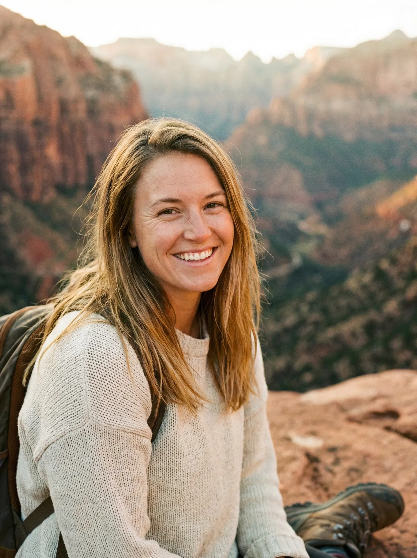 Young woman smiling outdoors in Utah red rock canyon