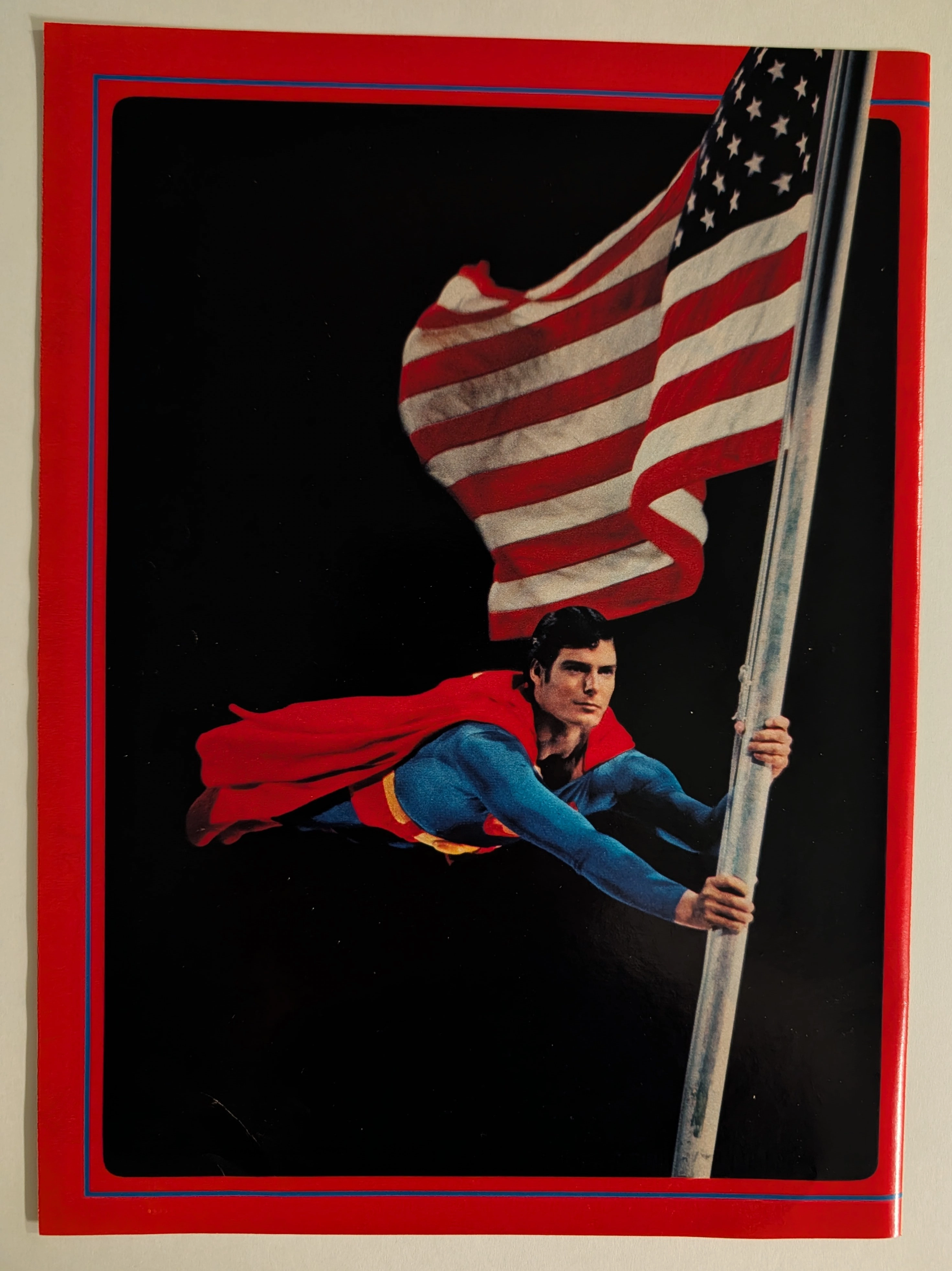 Superman: The Movie (1978) — โปสการ์ดตำนาน Christopher Reeve กับธงชาติอเมริกัน — The Record Institute Journal