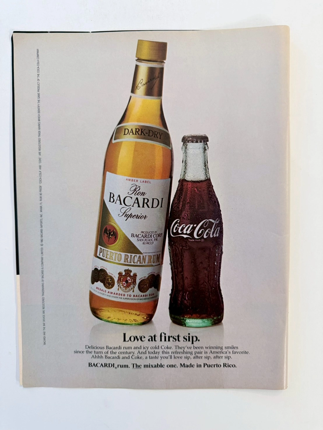 ปฏิญญาสองจักรวรรดิ: ชำแหละโฆษณาวินเทจ Bacardi และ Coca-Cola ปี 1982 ทรงอิทธิพลที่สุดแห่งยุค 80s (Class S) — The Record Institute Journal