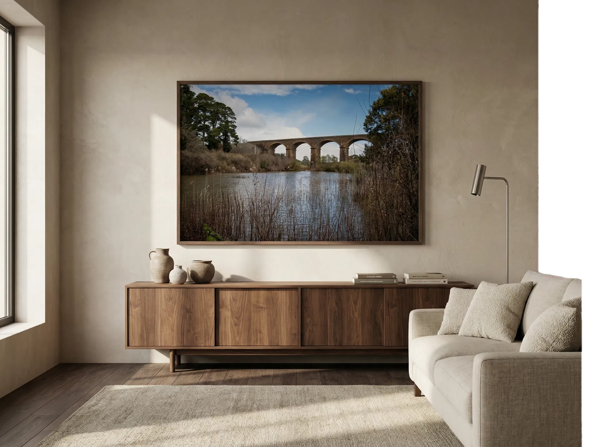 Historic Stone Arch Viaduct with Deep Span shown framed on the wall of a warm luxury living room.