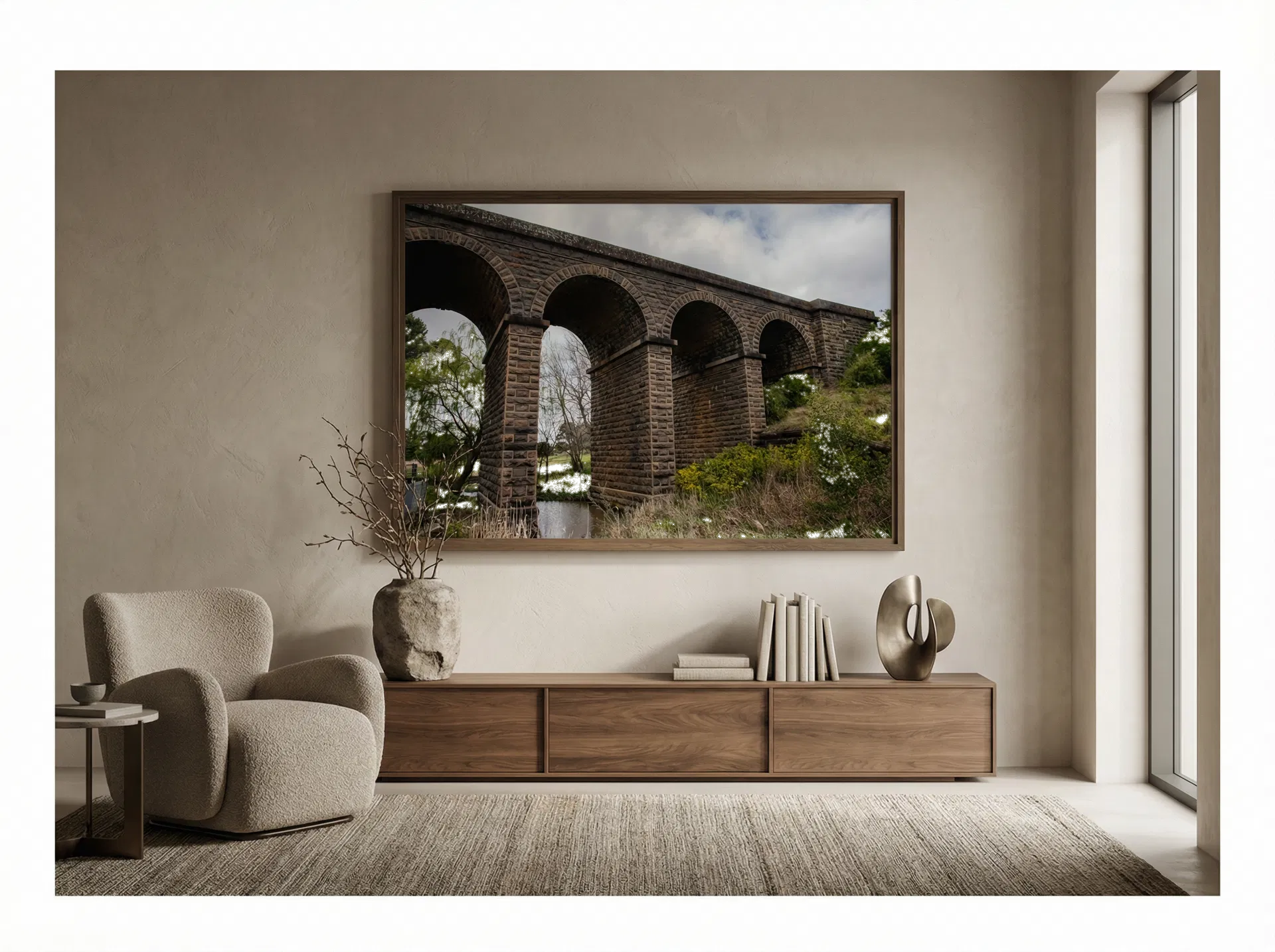 Historic Stone Arch Viaduct shown framed on the wall of a warm minimal luxury living room.