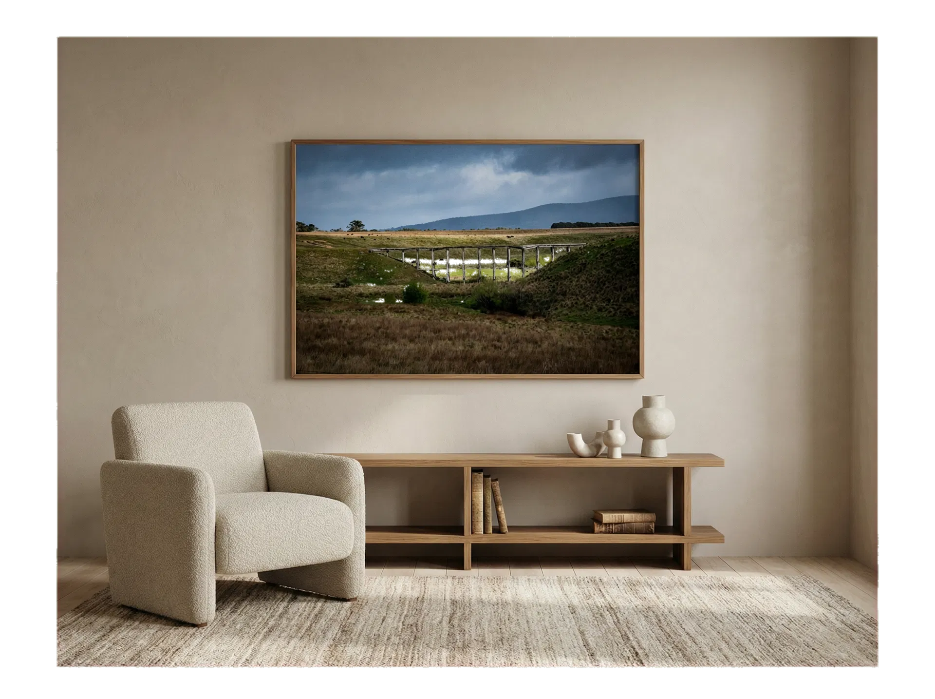 Rural Timber Viaduct Landscape shown framed on the wall of a warm, minimalist luxury living room.