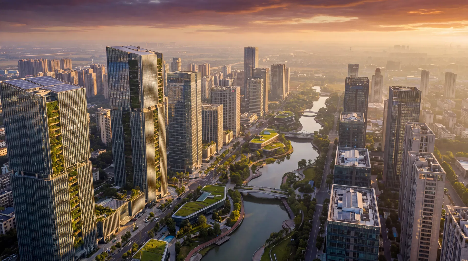 Aerial view of a sustainable modern city at golden hour with green buildings and river