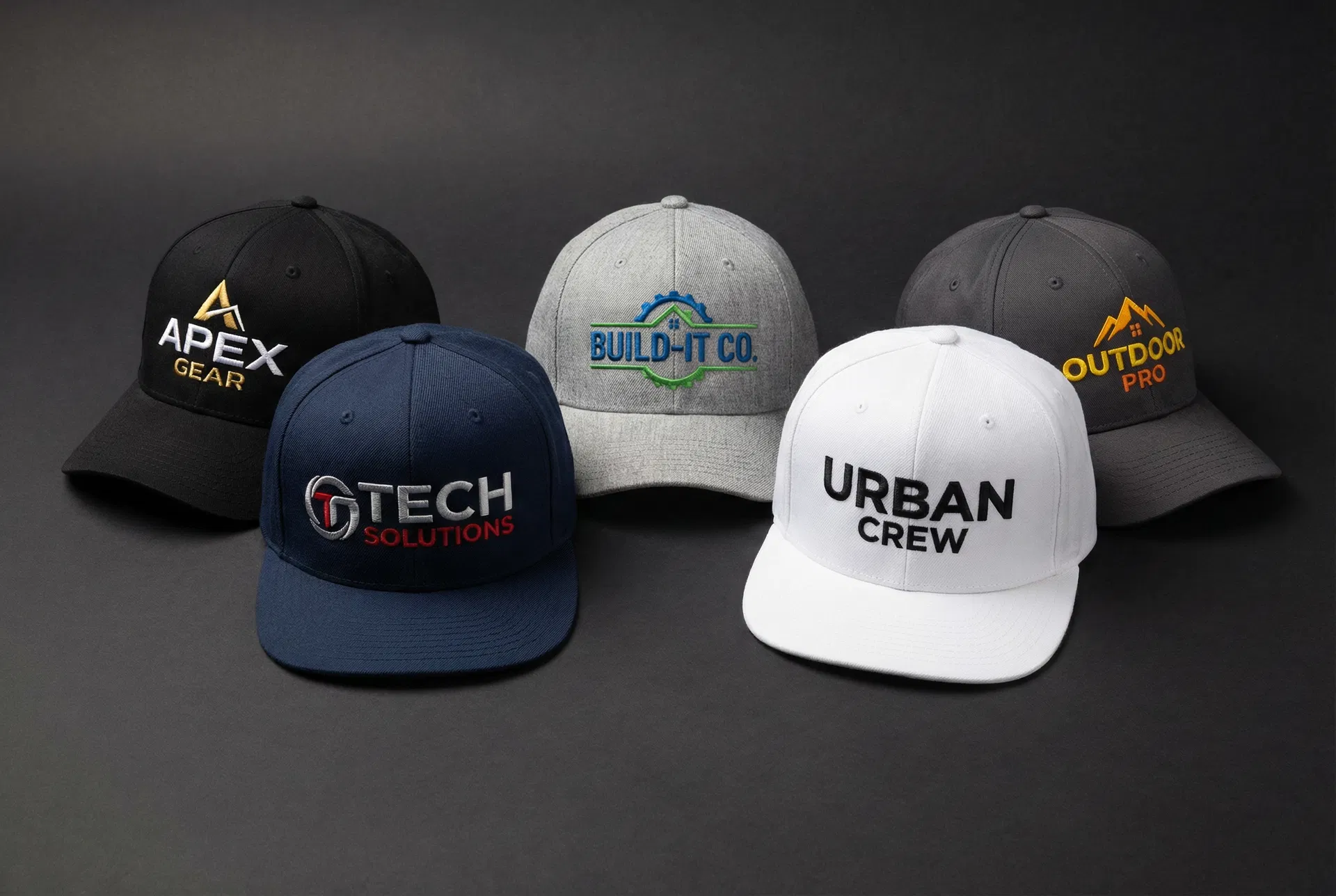 Custom embroidered branded hats and snapback caps in various colors with company logos