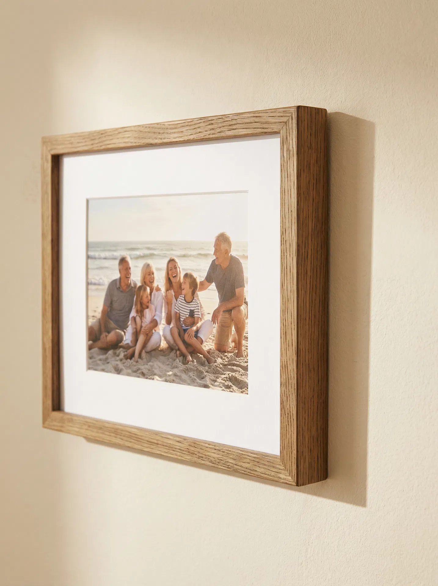 Close-up of a beautifully framed family photo on a warm cream wall