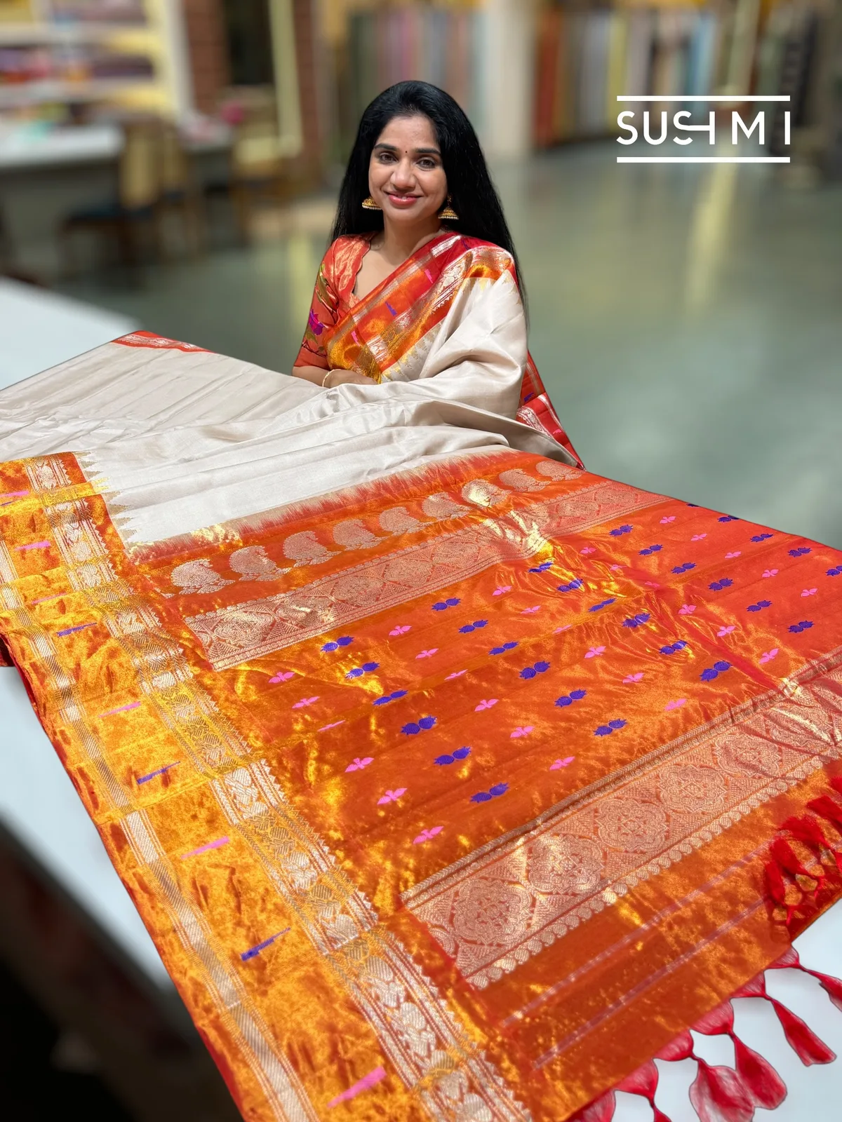 Dusty Beige Gadwal silk saree with single muniya pythani tissue border 