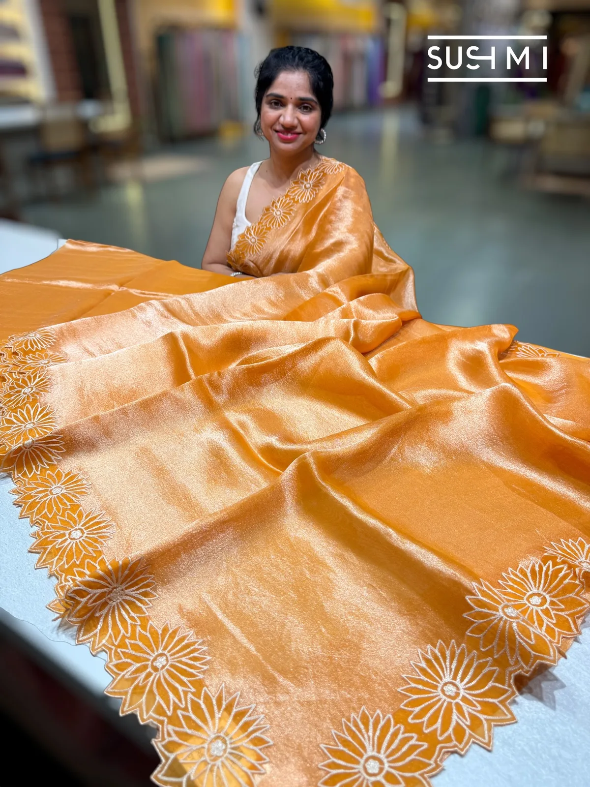 Light Orange Banarasi handloom Tissue with sunflower embroidered cutwork border