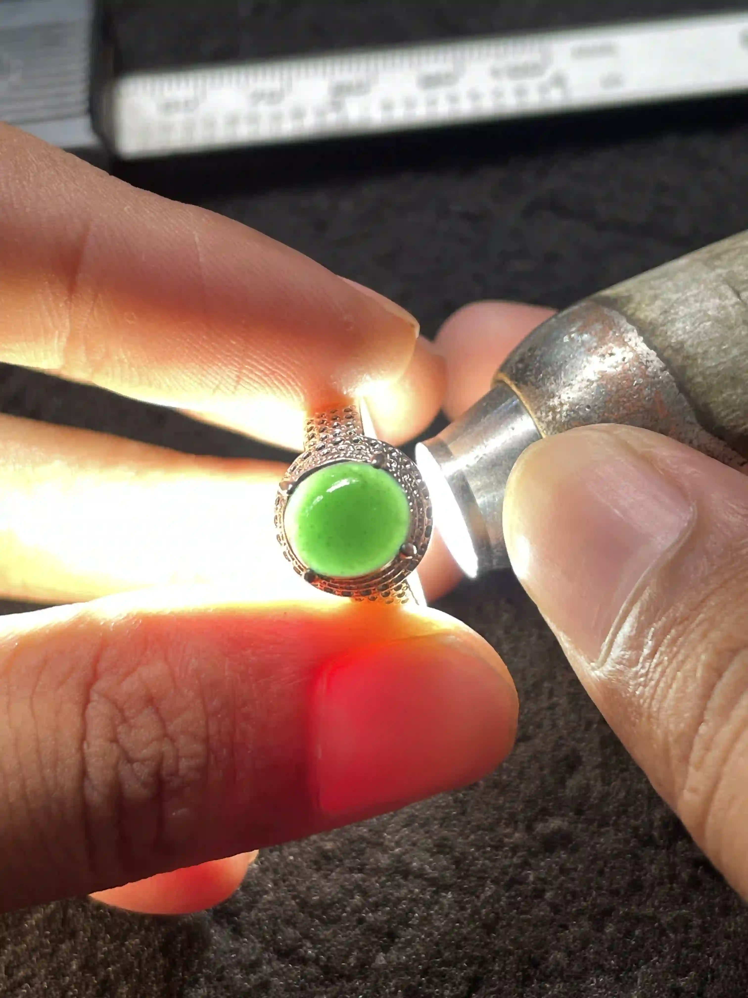 Vivid Green Jade Ring Under Light Inspection | Myanmar Jadeite reference #660001