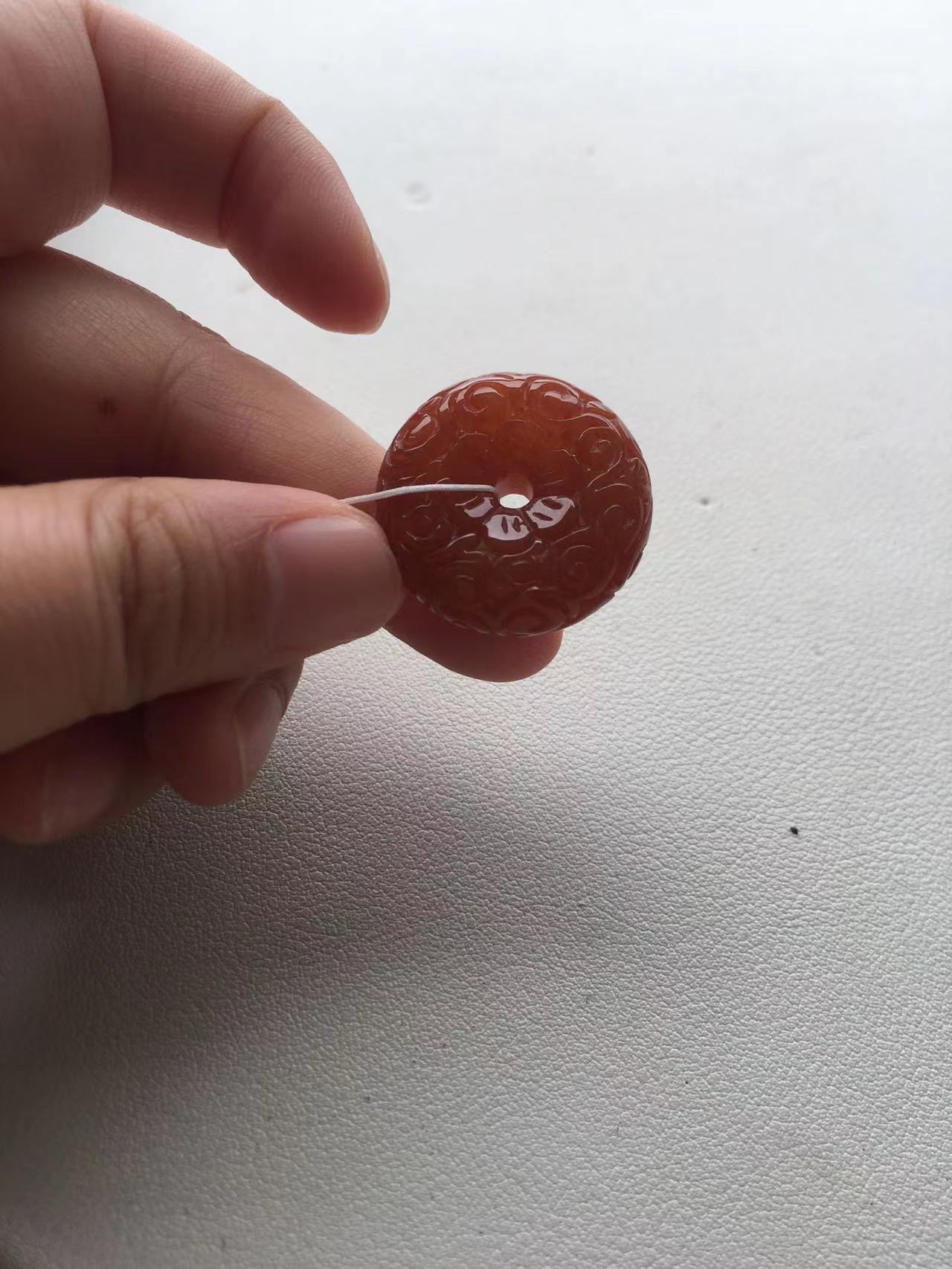 Natural Red Jade Carved Donut Pendant Natural Red Jade Carved Donut Pendant - Burmese Jadeite from Myanmar