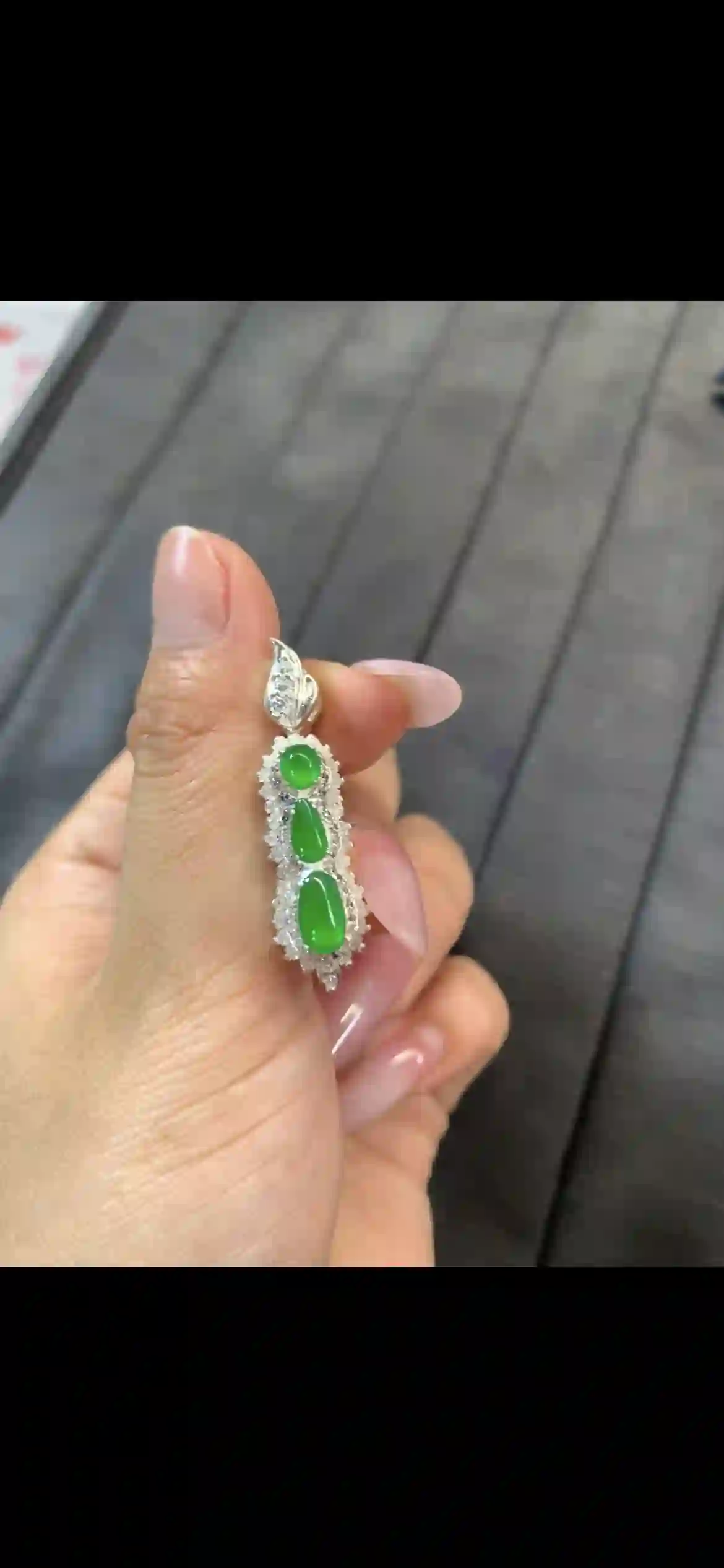 Vibrant Imperial Green Jadeite Three-Stone Pendant with Diamond Halo, view 2 | Myanmar Jadeite reference #10560002