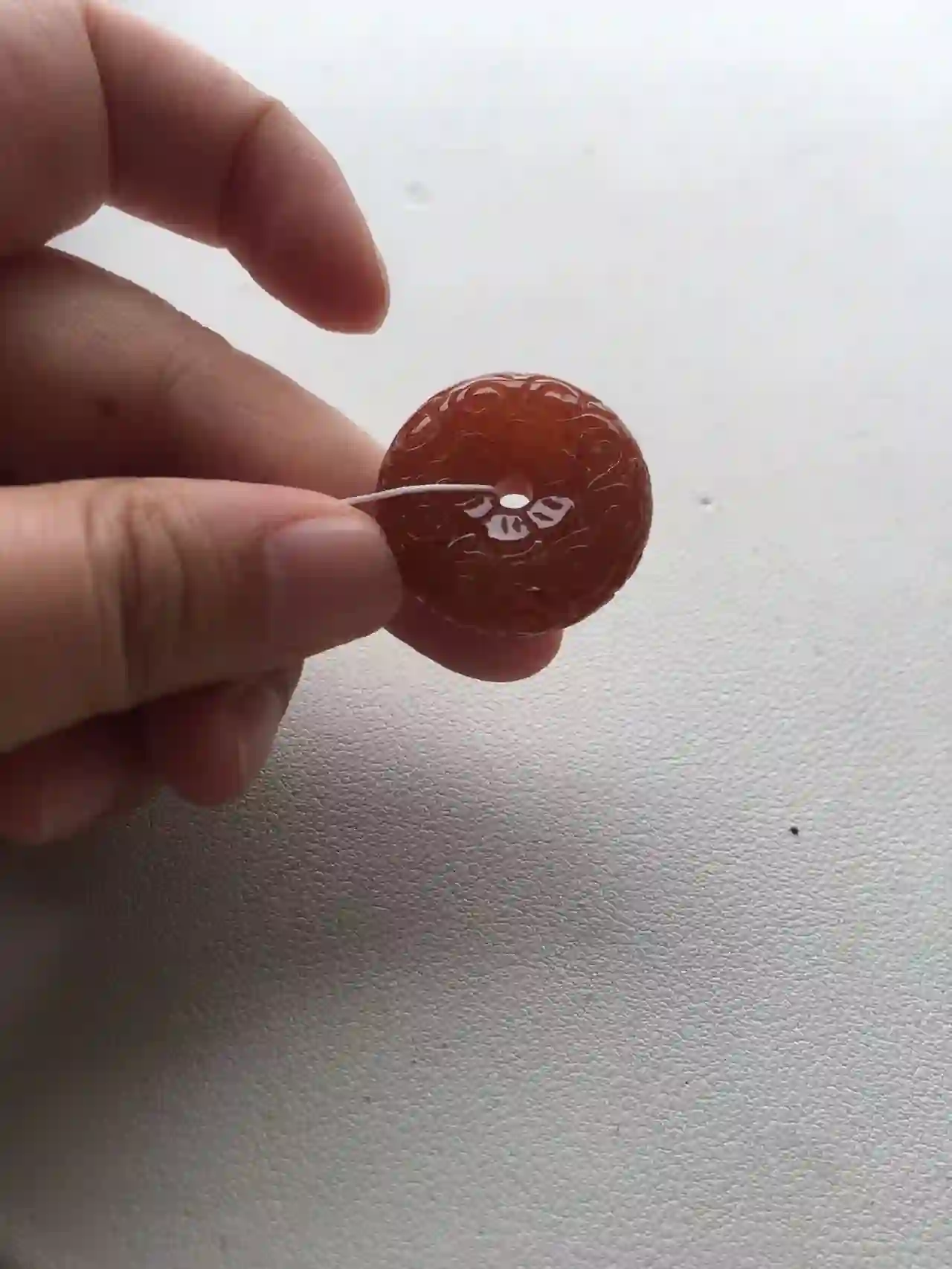   Natural Red Jade Carved Donut Pendant, view 2 | Myanmar Jadeite reference #2040018