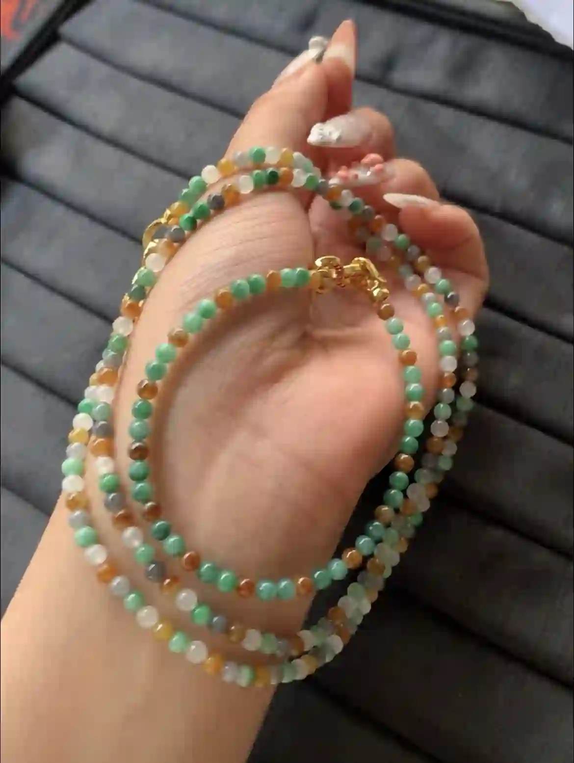 Multi-colored Beaded Necklace Held in Hand | Myanmar Jadeite reference #1080001