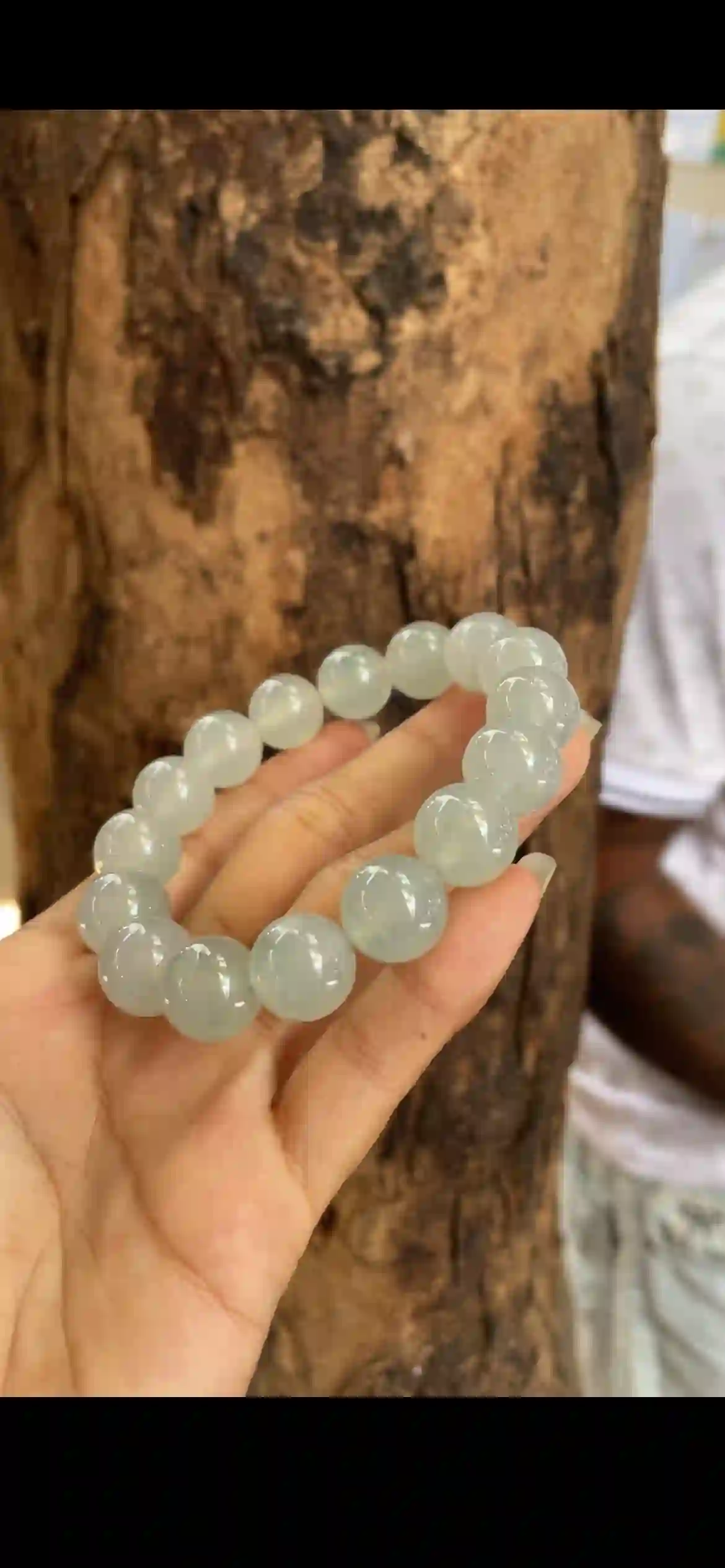 This exquisite bracelet features large, perfectly round icy jade beads with a soft pale blue‑green hue, outstanding glass‑like translucency, and a smooth mirror | Myanmar Jadeite reference #14280001