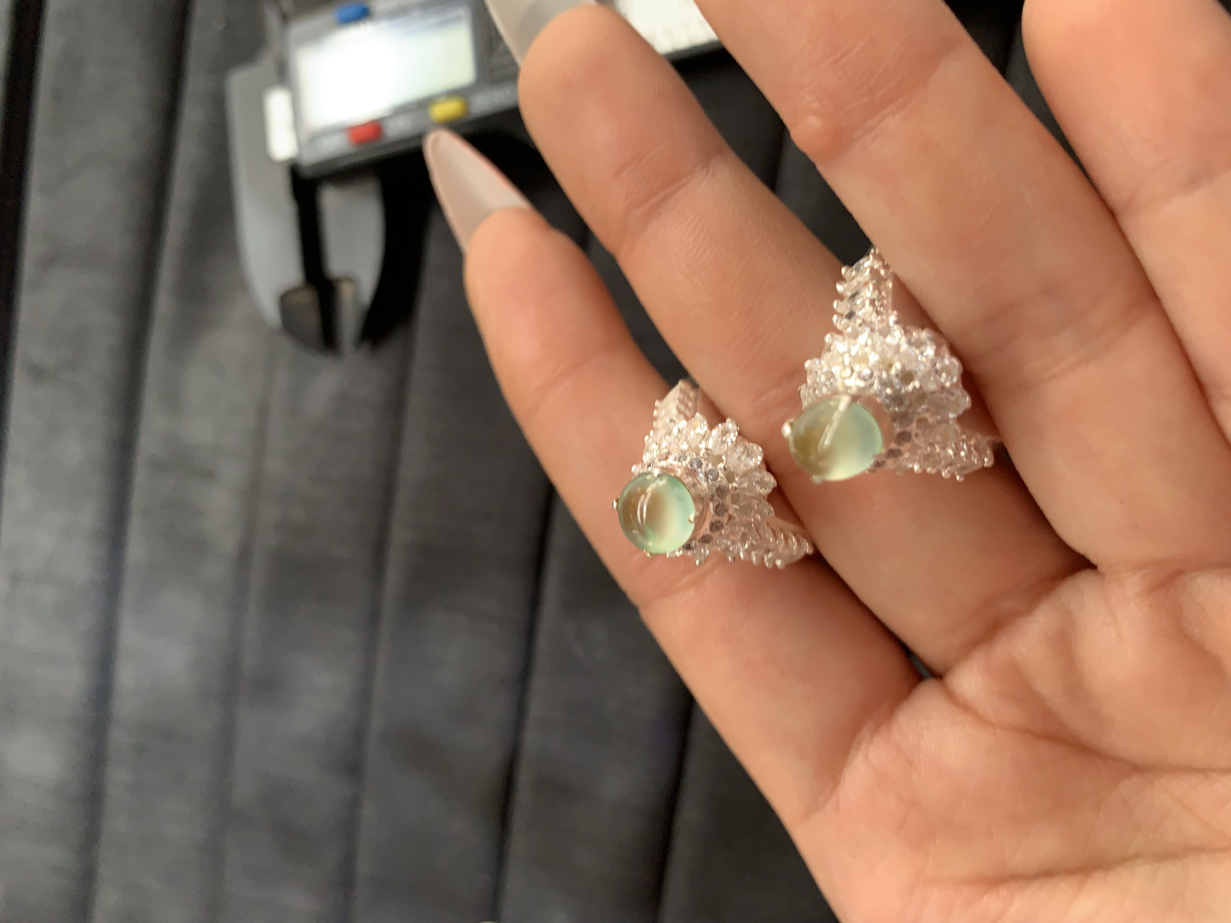 Pair of Silver-Toned Rings with Green Translucent Cabochons