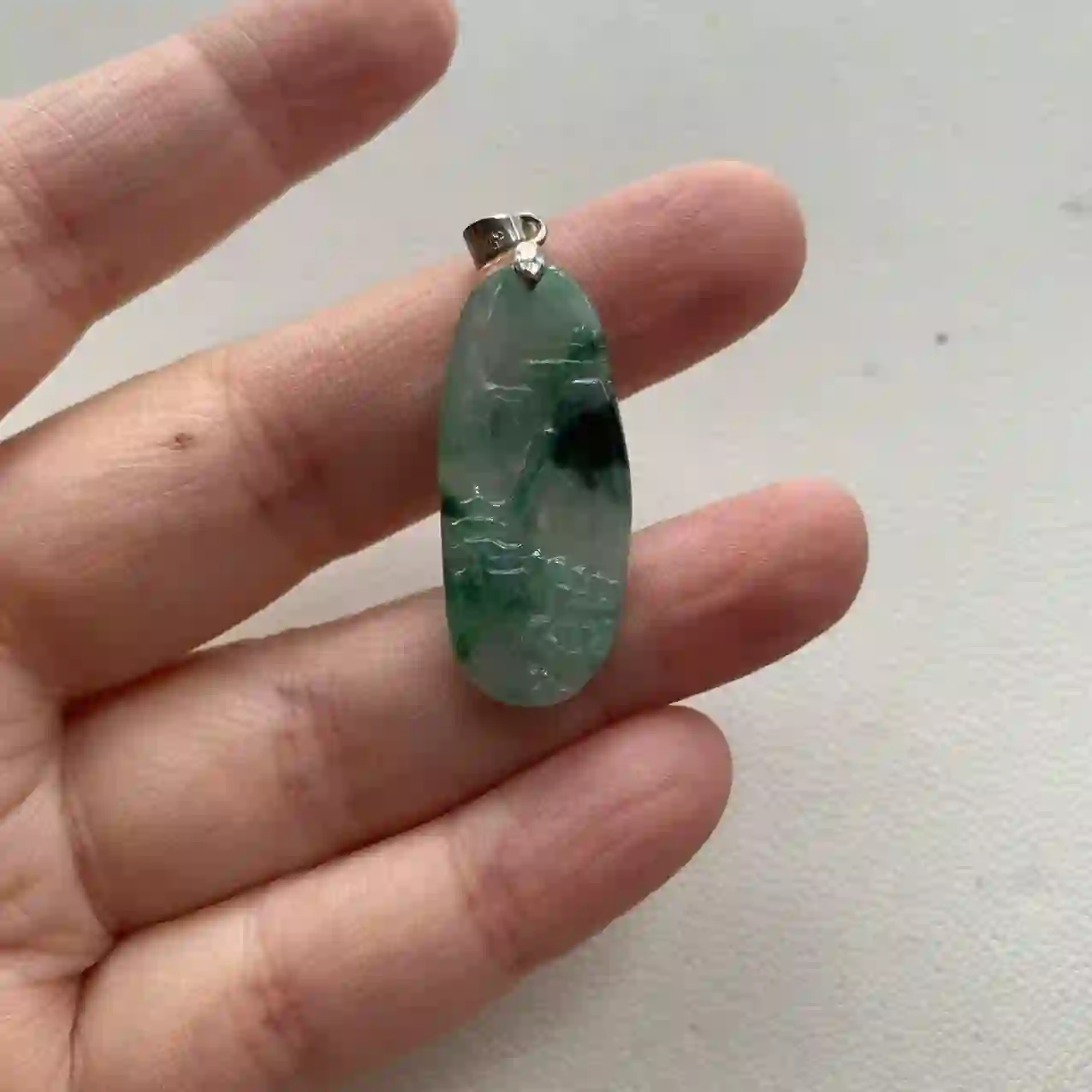 Icy Jade Pendant with Landscape Carving in Silver Setting | Myanmar Jadeite reference #2100013