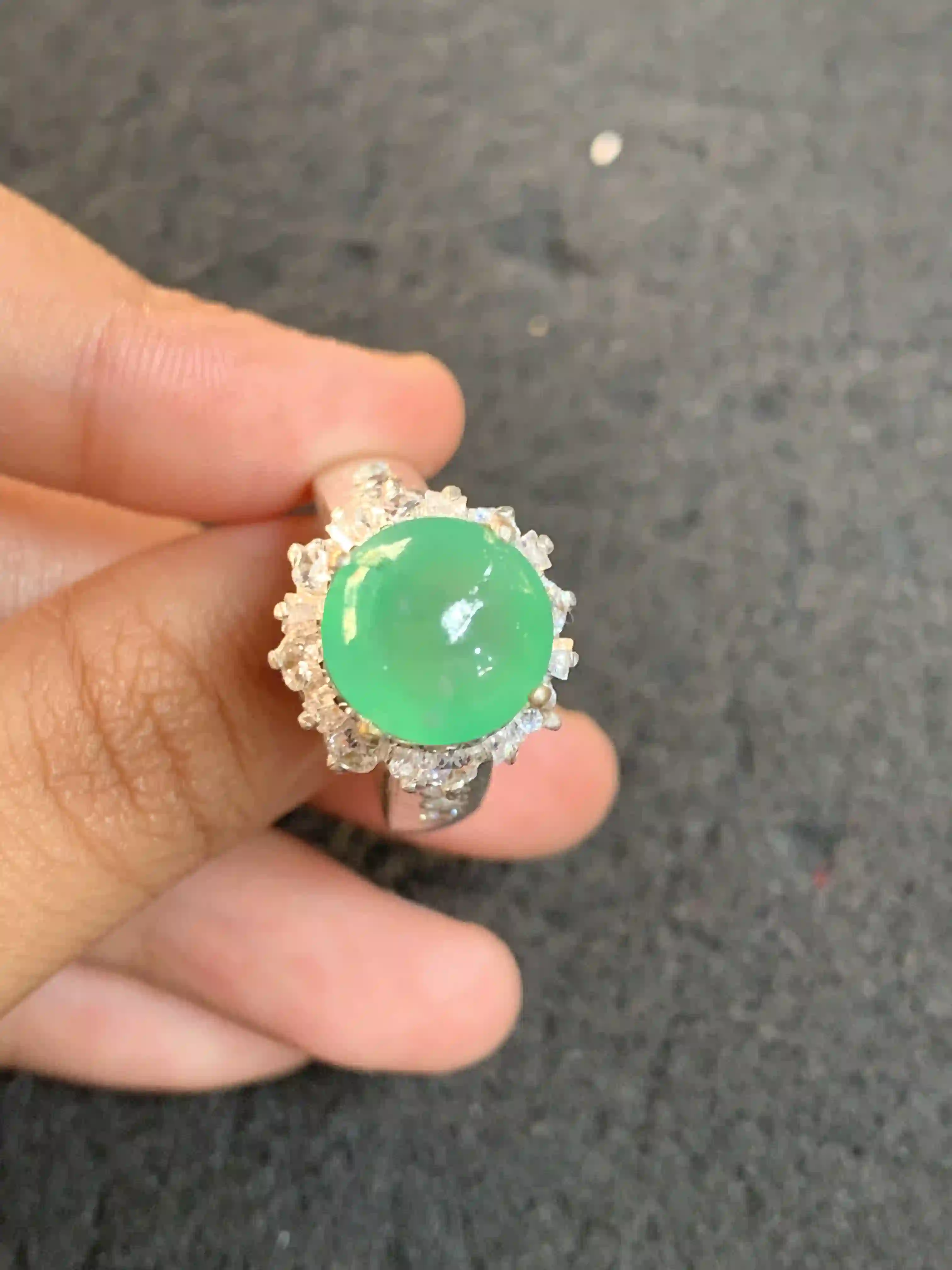 Vibrant Green Jadeite Cabochon Ring with Clear Stone Halo | Myanmar Jadeite reference #1410004