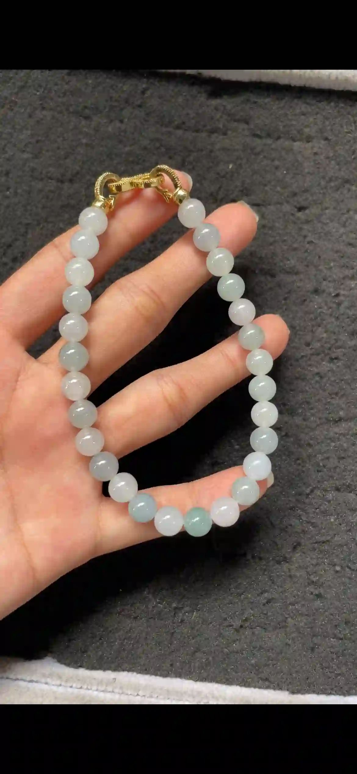  Icy Pale Celadon Jadeite Single‑Strand Bracelet with Gold Clasp, view 2 | Myanmar Jadeite reference #9480001