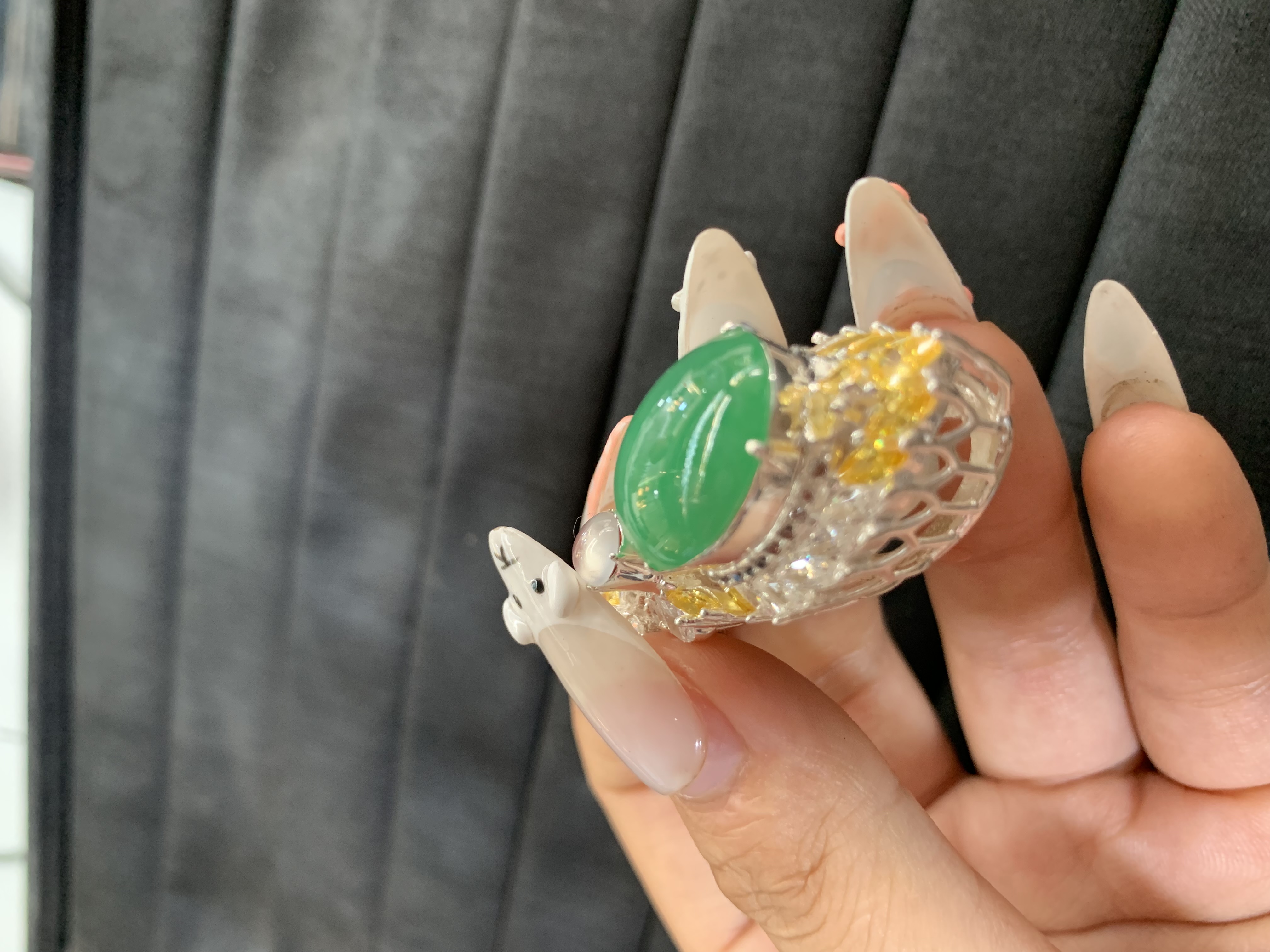 Exquisite Green Gemstone Ring with Dual-Tone Metal Design