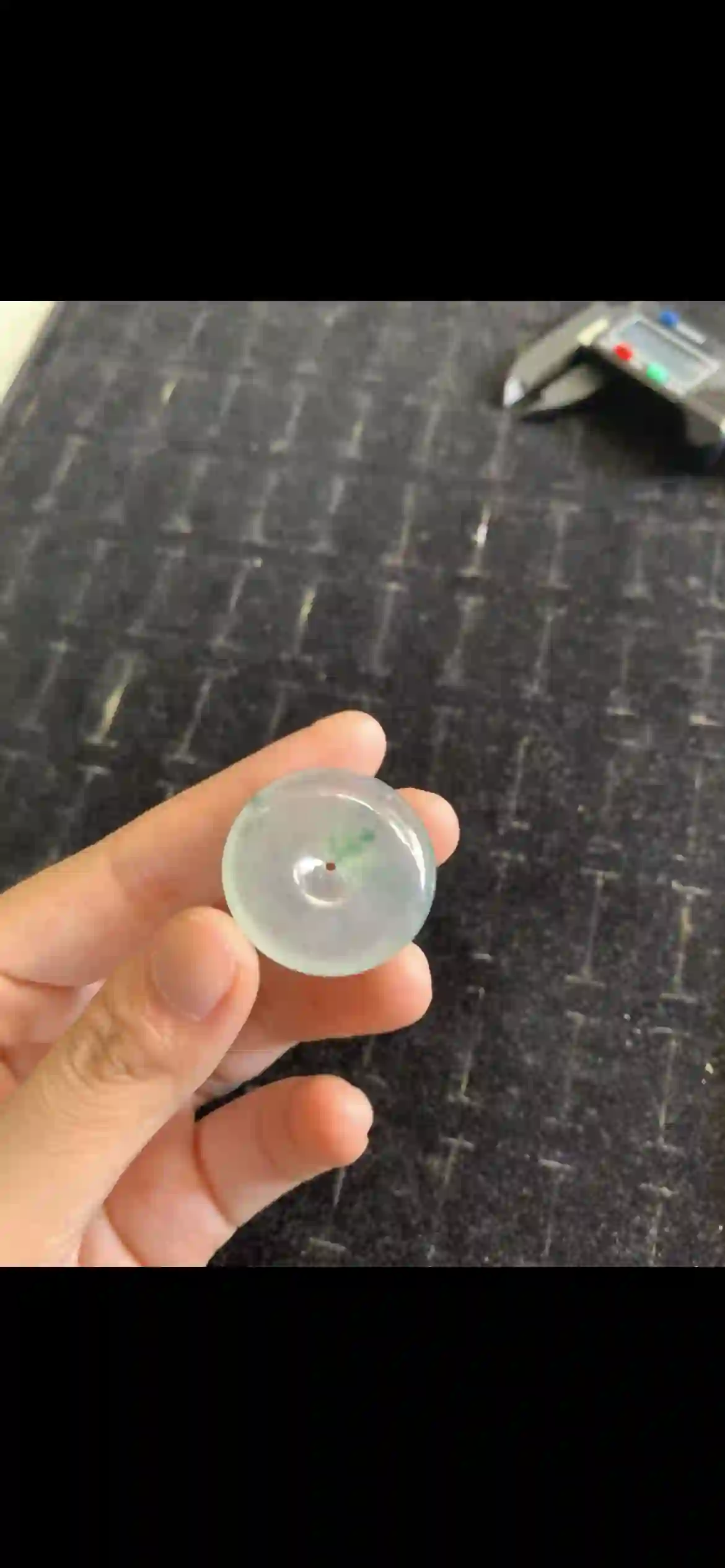 Icy Translucent Jade Donut Pendant with Floating Green Inclusions, view 2 | Myanmar Jadeite reference #21000001