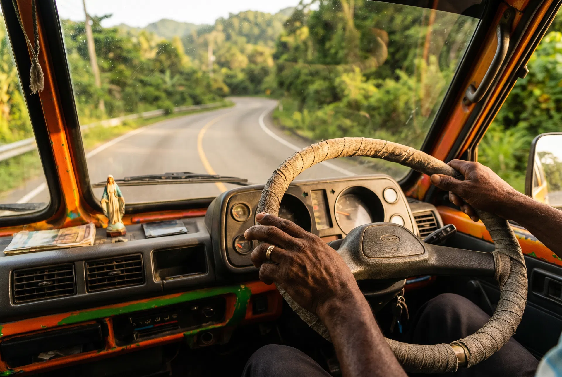 Bus driver navigating a tropical mountain road