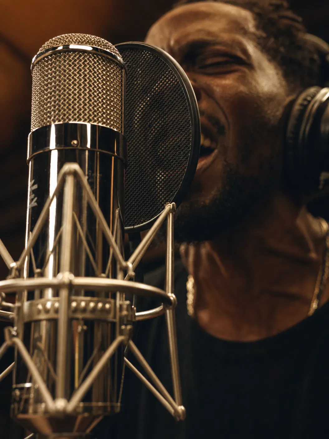 Close-up of microphone during intense vocal performance