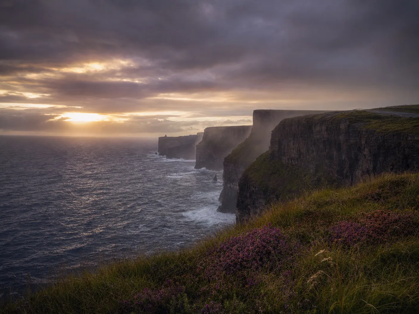 Irish Atlantic cliffs at twilight with heather