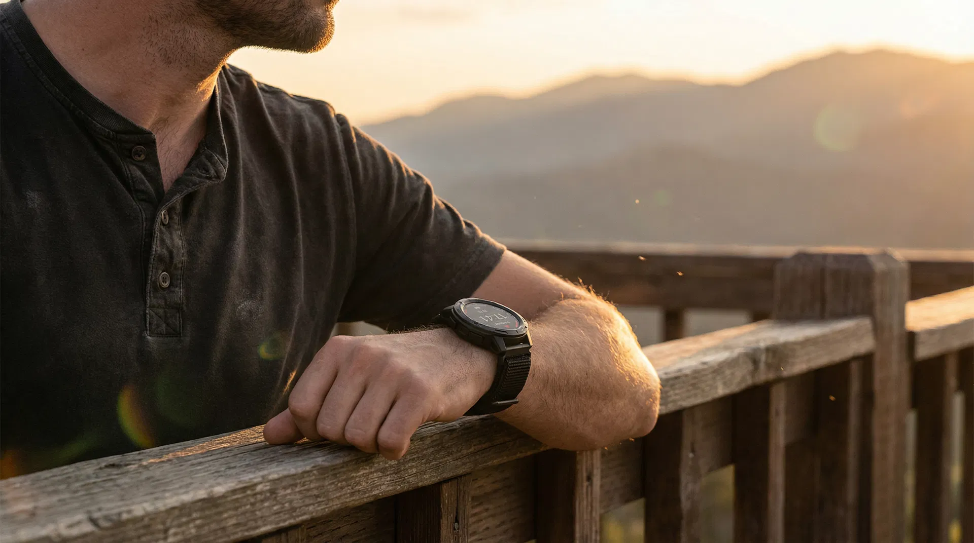 AlphaGear tactical watch on wrist during golden hour