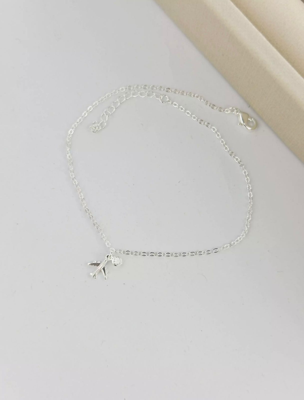 Tornozeleira Avião Ponto de Luz Prata