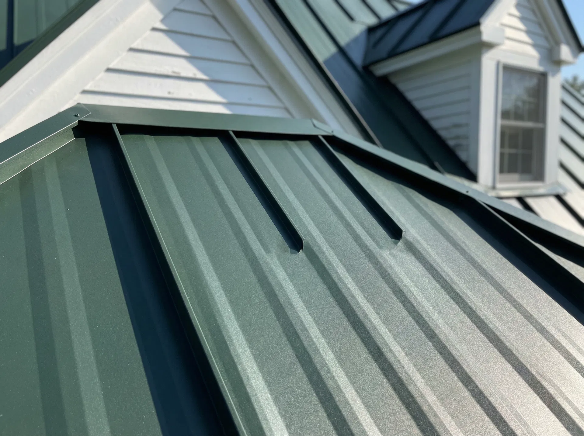 Forest Green standing seam metal roof close-up