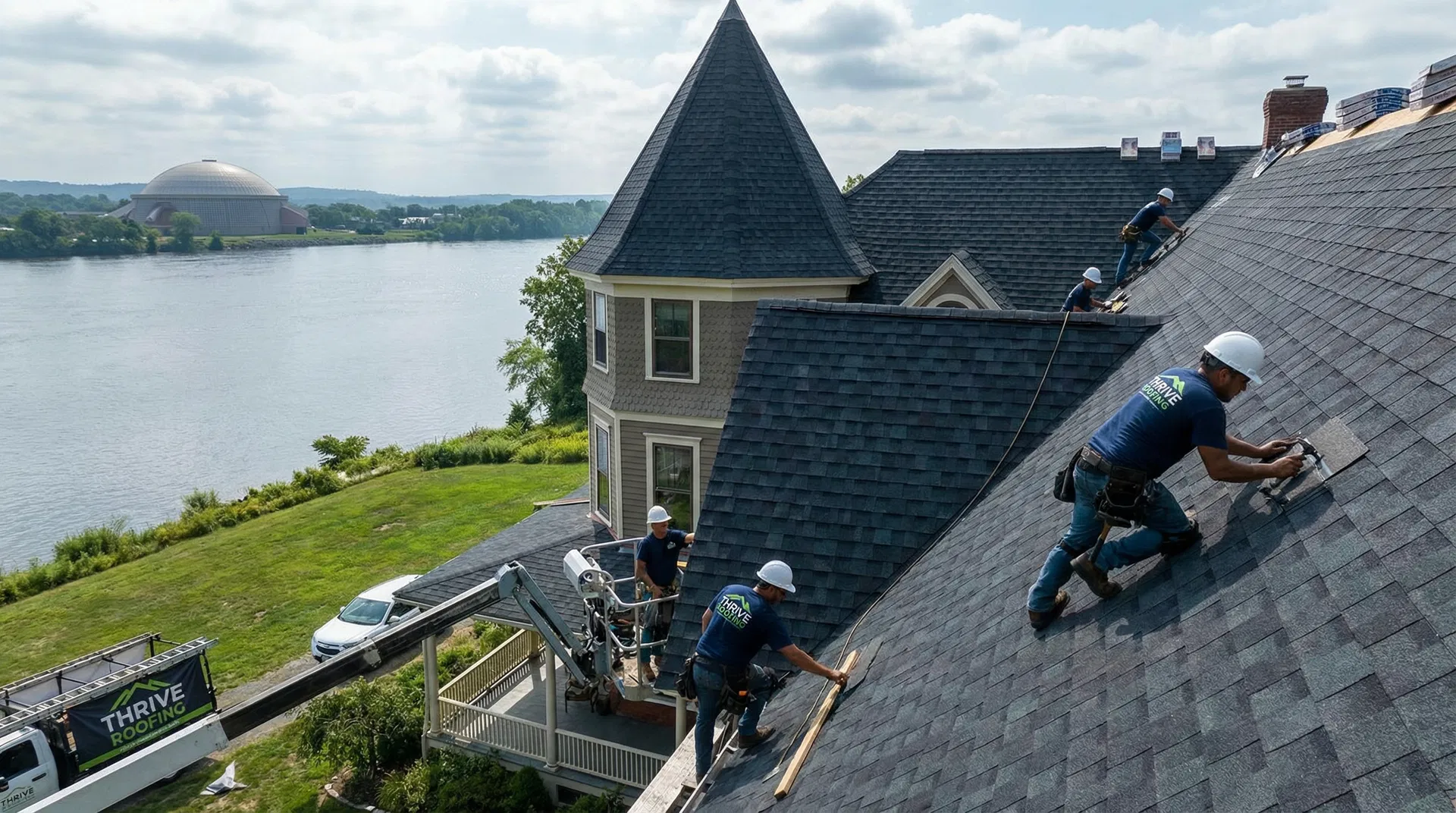 Thrive Roofing crew installing shingles on a home near the Basketball Hall of Fame in Springfield MA