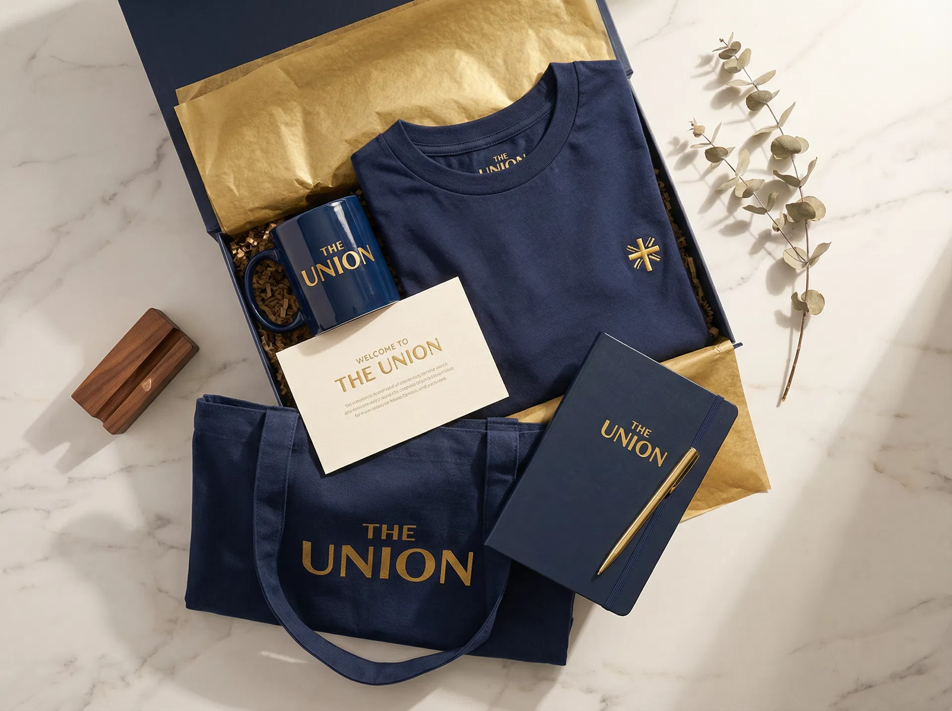 The Union Welcome Bundle — branded mug, t-shirt, tote bag, notebook, and welcome card
