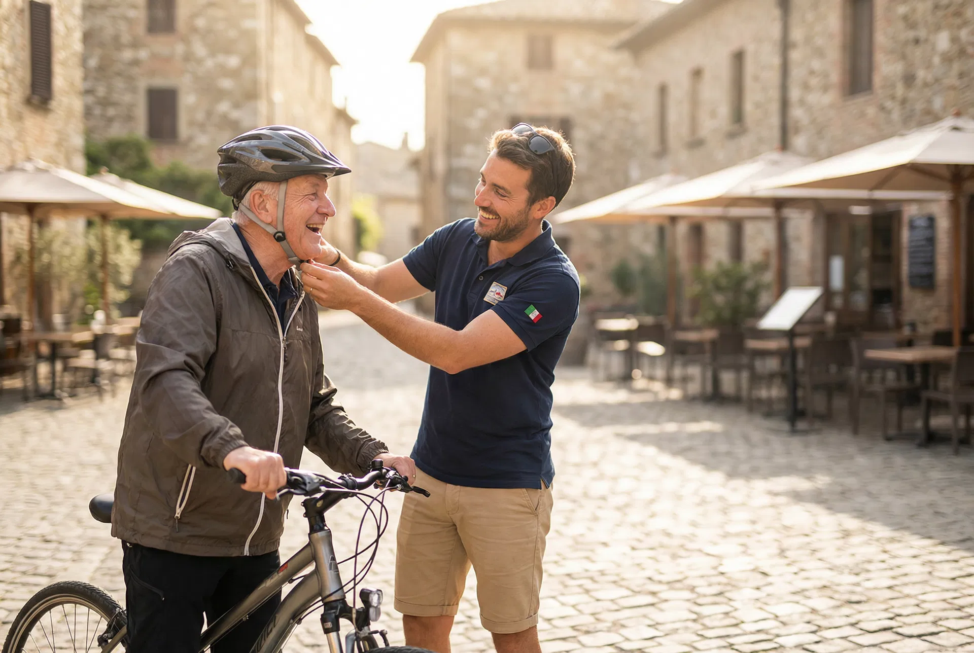 A cycling guide helping a guest in a European village