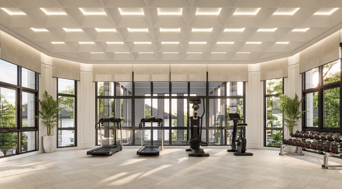RAKHA PATTAYA spacious fitness room with treadmills, exercise machines, and large windows.