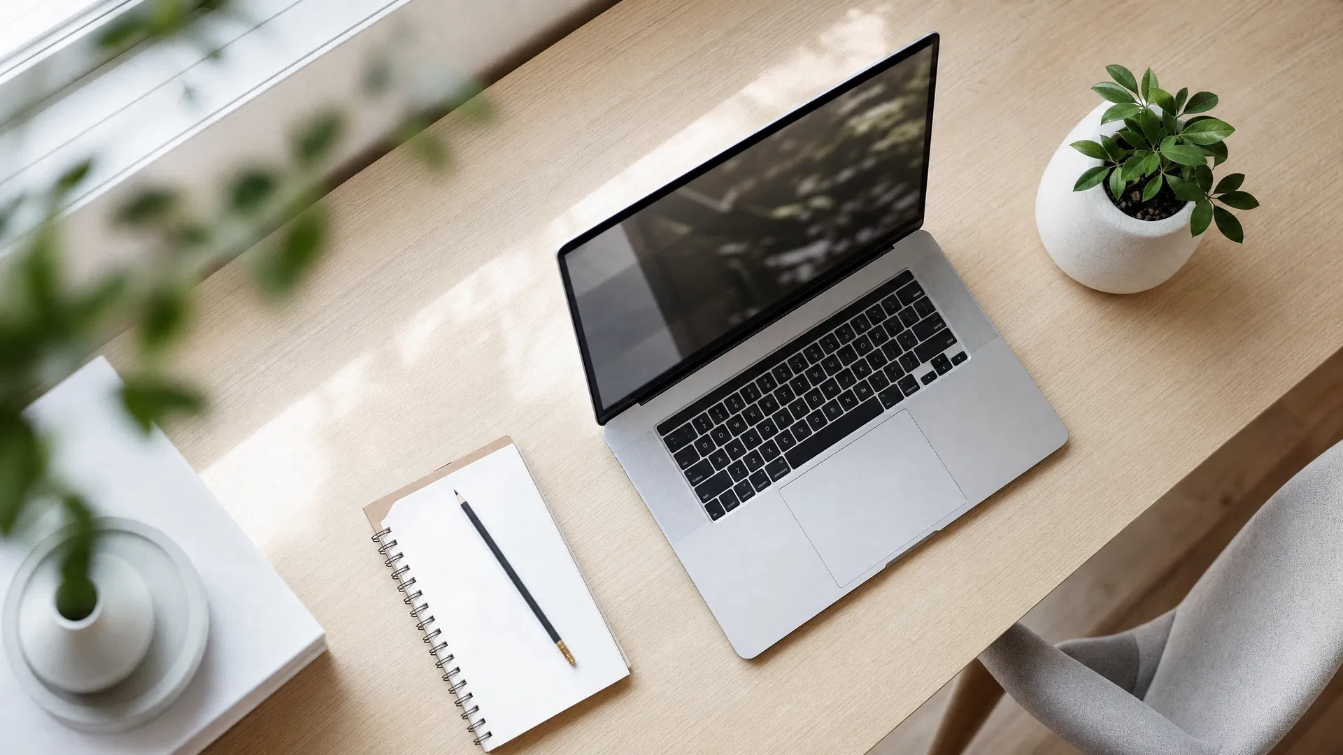Clean desk workspace with open laptop
