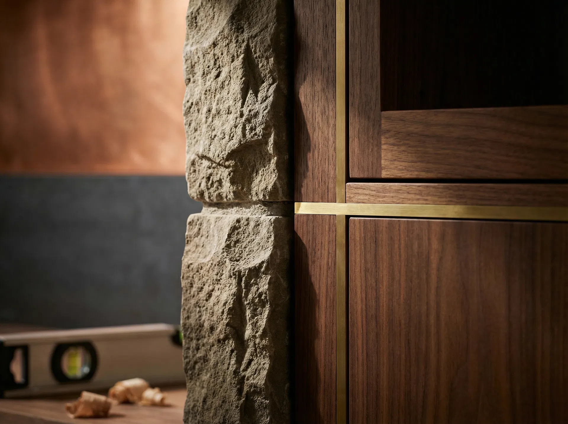 Craftsmanship detail — stone and walnut millwork