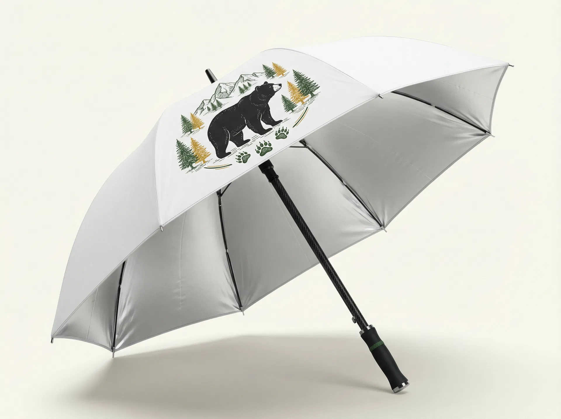 BearBrella open — white canopy with bear graphic, silver interior, carbon fibre shaft