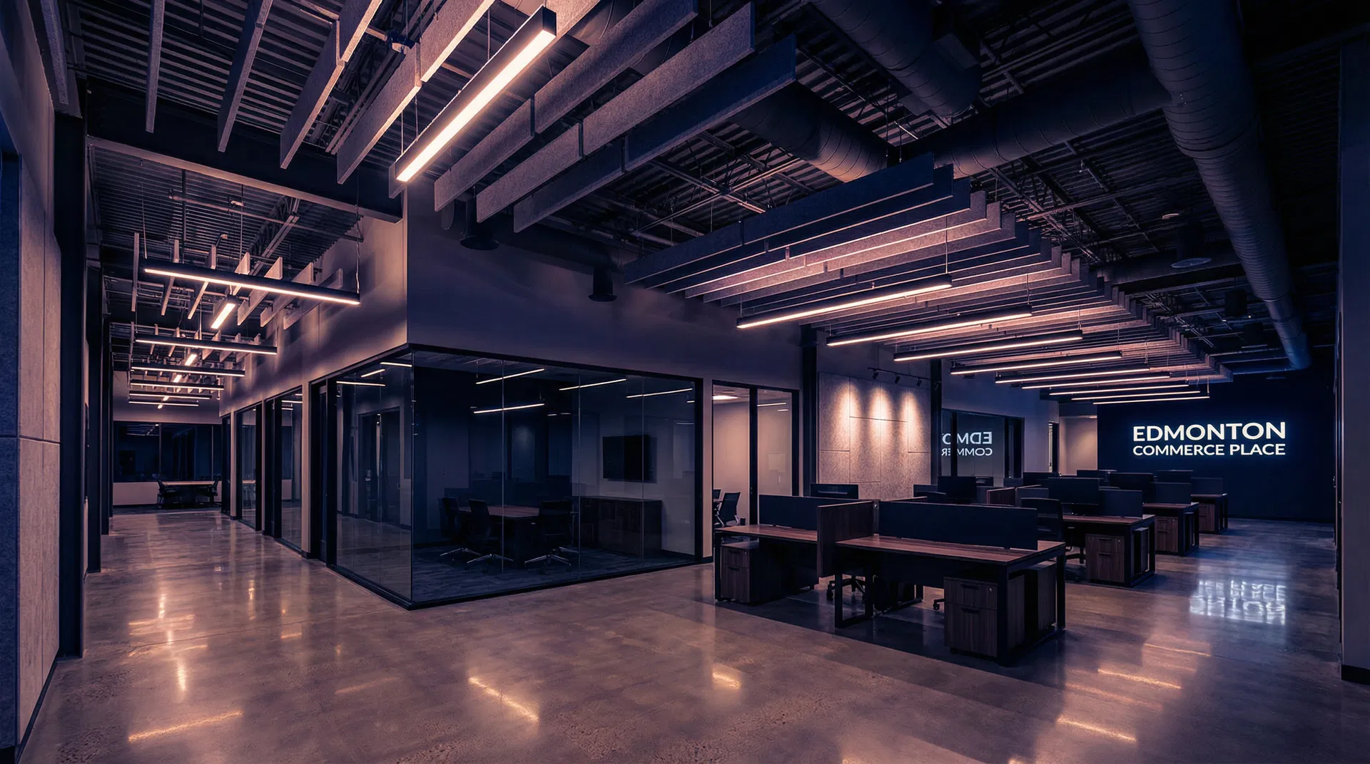Modern open plan office interior in Edmonton with exposed ceiling and glass partitions
