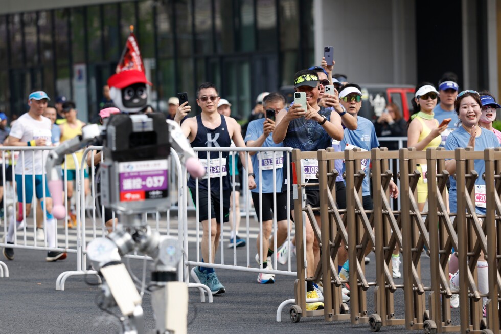 A humanoid robot sprints to victory in Beijing, beating the human half-marathon world record - AP News