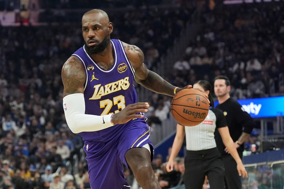 LeBron James has 26 points, 11 assists to lead Lakers past Warriors 119-103 as Stephen Curry sits - AP News