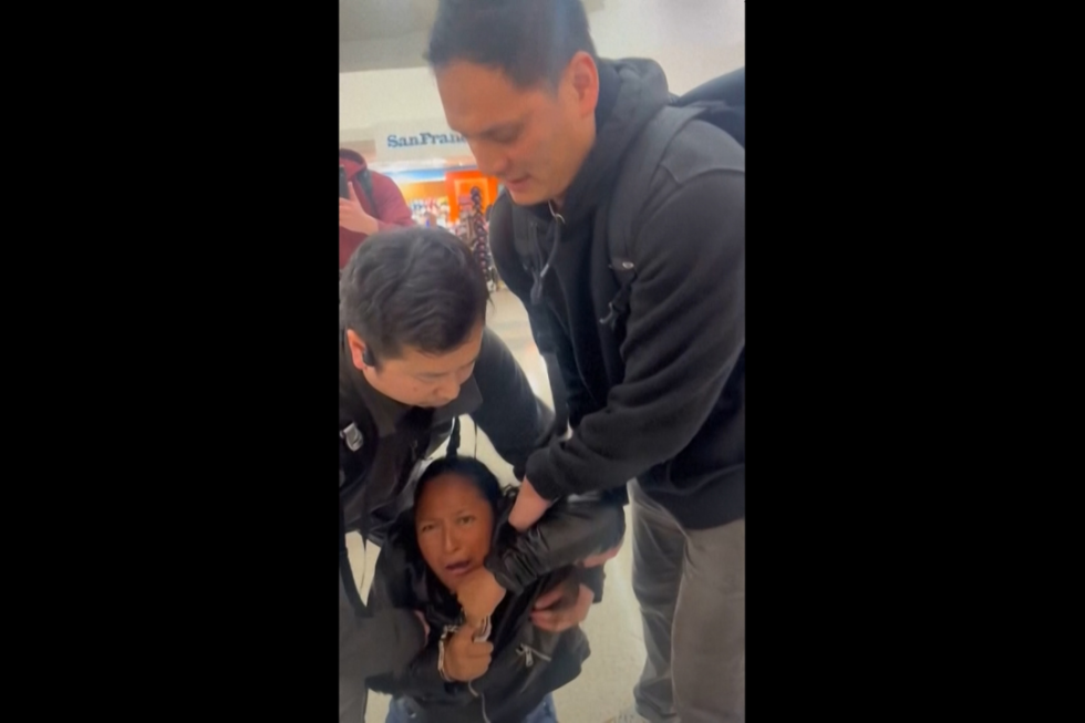 Video shows federal officers arresting crying woman at San Francisco airport - AP News