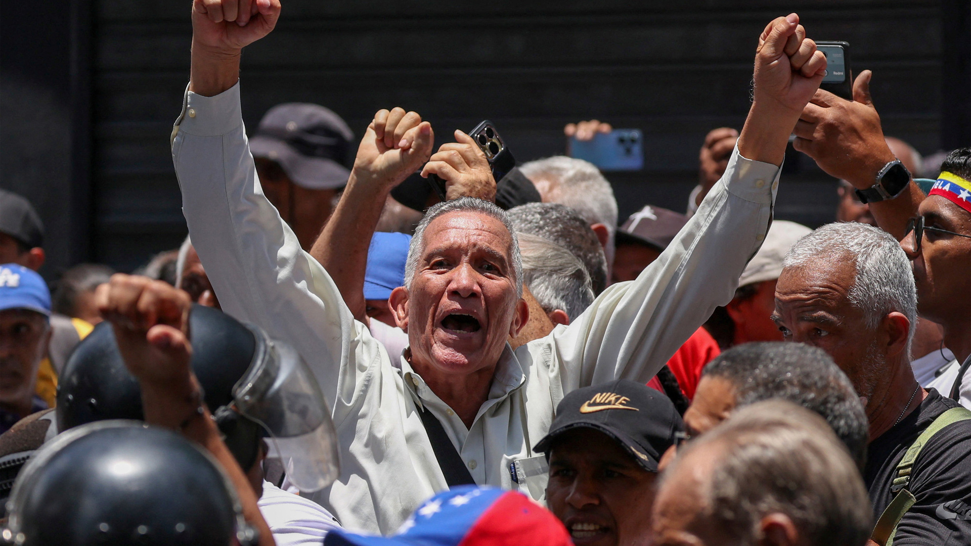 Riot police push back protesters demanding higher wages in Venezuela