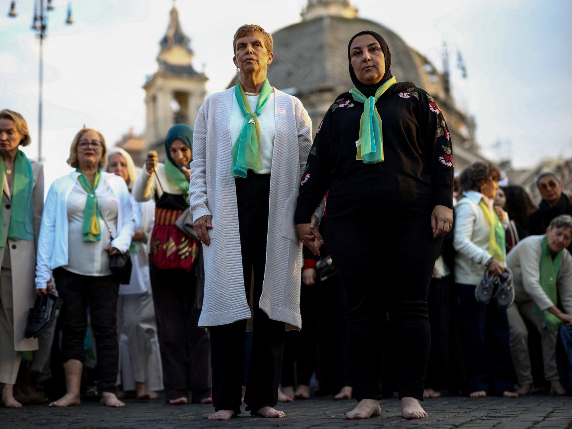 Israeli and Palestinian mothers call for peace on barefoot walk