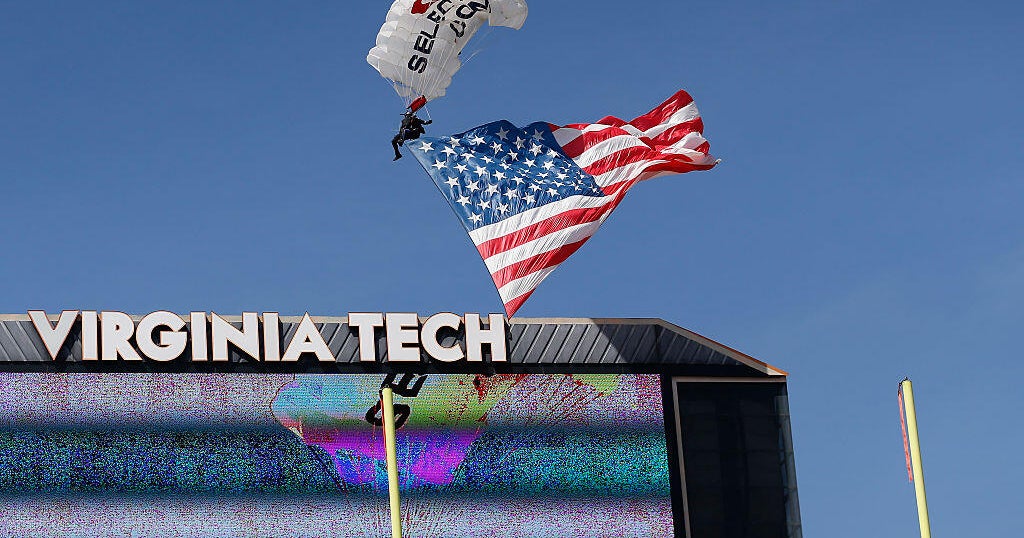 Skydiver rescued after crashing into scoreboard during Virginia Tech game